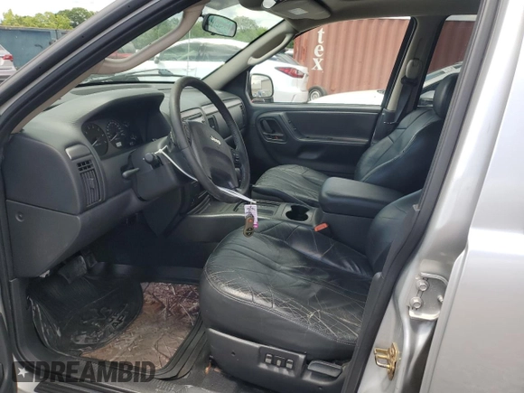 2004 Jeep Grand Cherokee Laredo z VIN 1J4GX48N94C386031, wystawiony jako Copart lot #55804755 z przebiegiem 160 103 mil mil oraz Szkoda całkowita • Salvage title. Historia ofert i sprzedaży dostępna na DreamBid. Obrazek 7.