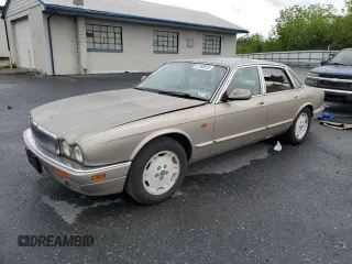 1995 Jaguar XJ with VIN SAJHX174XSC738856, listed as a Copart auction lot 57768915 with Not provided miles and Salvage title. Bid and sale history available at DreamBid. Image 1.