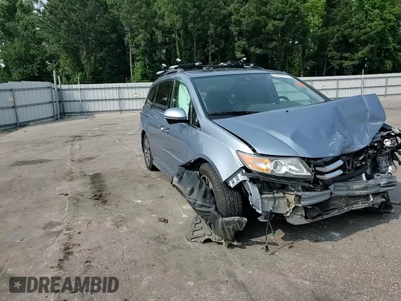 2014 Honda Odyssey Touring with VIN 5FNRL5H95EB080449, listed as a Copart auction lot 58489715 with 154,604 mi miles and Salvage title. Bid and sale history available at DreamBid. Image 14.