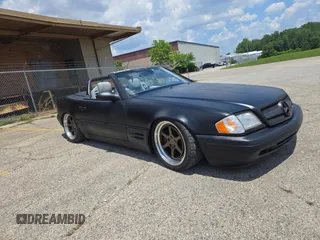 1999 Mercedes-Benz SL 500 with VIN WDBFA68FXXF184548, listed as a Copart auction lot 63814775 with 133,681 mi miles and Clean title. Bid and sale history available at DreamBid. Image 1.