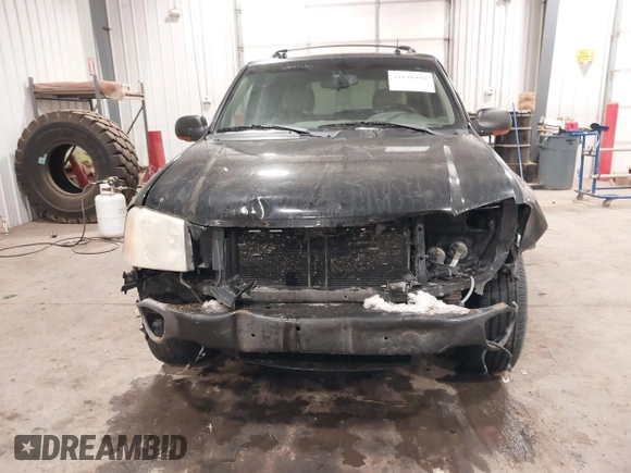 2005 GMC Envoy SLT with VIN 1GKDT13S452349125, listed as a IAAI auction lot 41148381 with 224,049 mi miles. Bid and sale history available at carsss.com. Image 6.