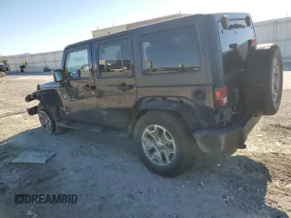 2013 Jeep Wrangler Unlimited Rubicon 10th Anniversary с VIN 1C4HJWFG7DL559539, выставлен на аукционе Copart как лот 81675894 с пробегом 99 425 миль миль и Списание • Salvage title. История ставок и продаж доступна на DreamBid. Изображение 2.