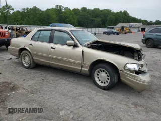 1999 Ford Crown Victoria LX с VIN 2FAFP74W7XX231833, выставлен на аукционе Copart как лот 58340925 с пробегом 156 032 миль миль и Списание • Salvage title. История ставок и продаж доступна на DreamBid. Изображение 4.