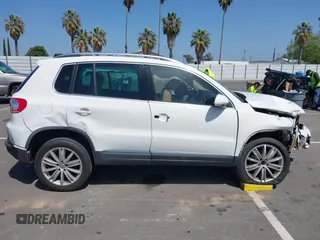 2014 Volkswagen Tiguan SEL with VIN WVGAV3AX9EW512956, listed as a IAAI auction lot 42110002 with 136,034 mi miles and . Bid and sale history available at DreamBid. Image 13.