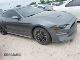 2021 Ford Mustang EcoBoost z VIN 1FA6P8TH9M5141038, wystawiony jako IAAI lot #41965588 z przebiegiem 35 344 mil mil oraz . Historia ofert i sprzedaży dostępna na DreamBid. Obrazek 6.