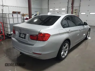 2014 BMW 3 Series 328d xDrive with VIN WBA3D5C55EF147308, listed as a IAAI auction lot 41499435 with 104,941 mi miles. Bid and sale history available at carsss.com. Image 4.
