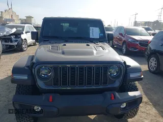 2025 Jeep Wrangler Rubicon with VIN 1C4PJXFNXSW532895, listed as a IAAI auction lot 42694548 with 1,886 mi miles and . Bid and sale history available at DreamBid. Image 6.