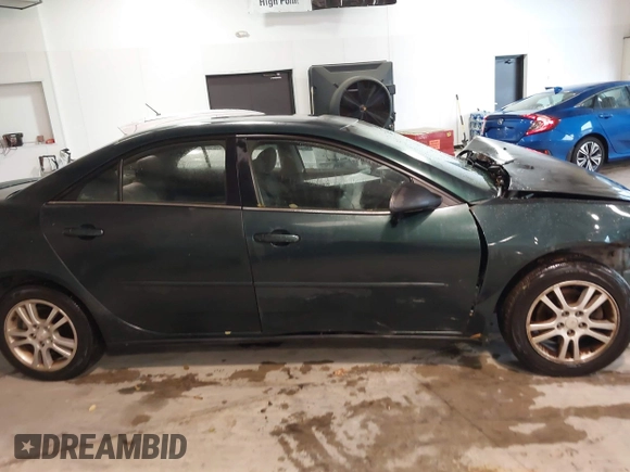 2006 Pontiac G6 6-Cyl z VIN 1G2ZG558664233613, wystawiony jako IAAI lot #41075907 z przebiegiem 228 361 mil mil oraz . Historia ofert i sprzedaży dostępna na DreamBid. Obrazek 13.