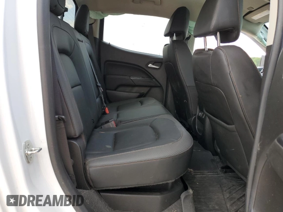 2021 GMC Canyon 4WD AT4 z VIN 1GTG6FEN9M1147406, wystawiony jako Copart lot #55454634 z przebiegiem 82 898 mil mil oraz Szkody całkowita. Historia ofert i sprzedaży dostępna na DreamBid. Obrazek 10.