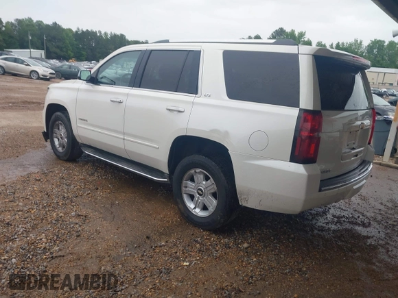 2015 Chevrolet Tahoe LTZ with VIN 1GNSCCKC1FR265370, listed as a IAAI auction lot 42131294 with 217,064 mi miles and . Bid and sale history available at DreamBid. Image 3.