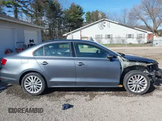 2015 Volkswagen Jetta Sedan 1.8T SE w/Connectivity with VIN 3VWD07AJ2FM312146, listed as a IAAI auction lot 41843238 with 107,741 mi miles. Bid and sale history available at carsss.com. Image 13.