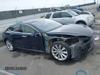 2014 Tesla Model S 60 with VIN 5YJSA1H10EFP30234, listed as a IAAI auction lot 42182249 with 186,654 mi miles and . Bid and sale history available at DreamBid. Image 13.