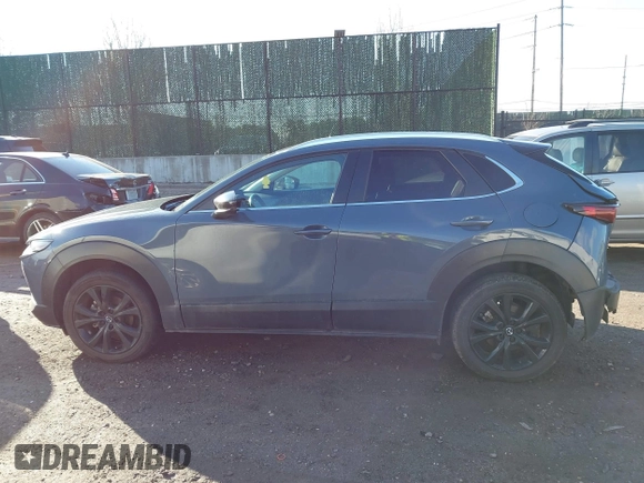 2023 Mazda CX-30 S Carbon Edition with VIN 3MVDMBCM3PM579345, listed as a IAAI auction lot 41689892 with 18,621 mi miles and . Bid and sale history available at DreamBid. Image 14.