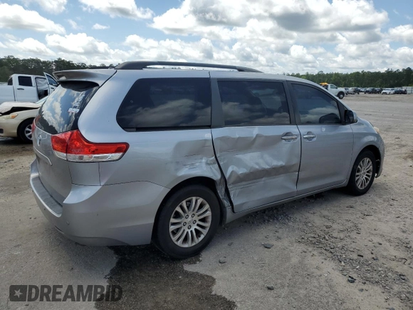 2011 Toyota Sienna XLE AAS with VIN 5TDYK3DC2BS011343, listed as a Copart auction lot 61223675 with 187,206 mi miles and Salvage title. Bid and sale history available at DreamBid. Image 3.