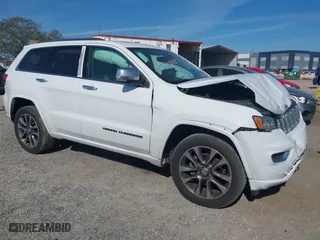 2017 Jeep Grand Cherokee Overland with VIN 1C4RJECG5HC959981, listed as a IAAI auction lot 41638958 with 102,122 mi miles. Bid and sale history available at carsss.com. Image 1.