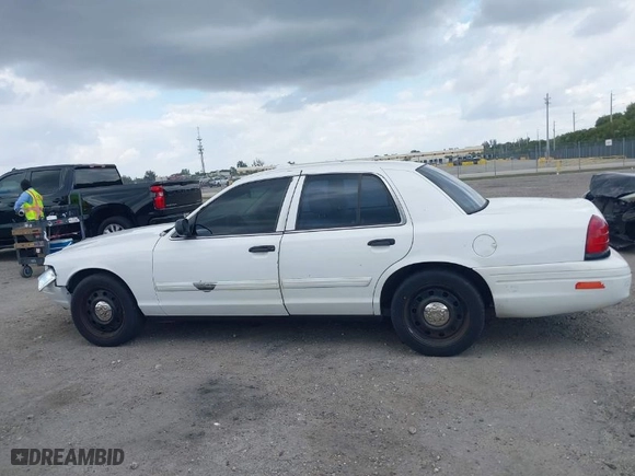 2009 Ford Police Interceptor with VIN 2FAHP71V99X149206, listed as a IAAI auction lot 41733924 with 142,876 mi miles. Bid and sale history available at carsss.com. Image 14.