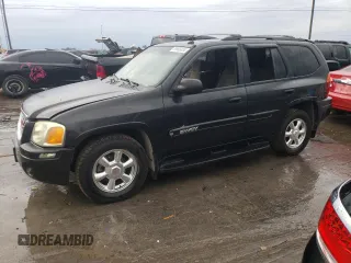 2004 GMC Envoy SLT with VIN 1GKDT13S042310076, listed as a Copart auction lot 79965854 with 220,506 mi miles and Salvage Title. Bid and sale history available at carsss.com. Image 1.