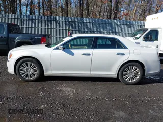 2013 Chrysler 300 with VIN 2C3CCAKGXDH733148, listed as a IAAI auction lot 41541442 with 216,074 mi miles. Bid and sale history available at carsss.com. Image 14.