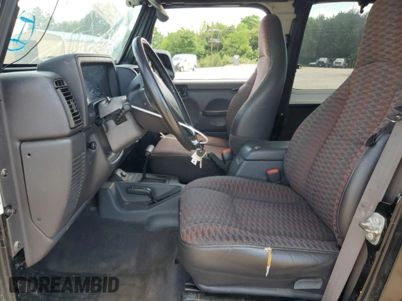 1999 Jeep Wrangler Sport with VIN 1J4FY19S9XP423684, listed as a Copart auction lot 55079455 with 149,756 mi miles and Salvage Title. Bid and sale history available at carsss.com. Image 7.
