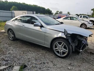 2012 Mercedes-Benz E 350 with VIN WDDKJ5KB1CF169890, listed as a Copart auction lot 57423244 with 101,569 mi miles and Salvage Title. Bid and sale history available at DreamBid. Image 4.