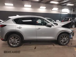 2021 Mazda CX-5 Grand Touring with VIN JM3KFBDM7M1392644, listed as a IAAI auction lot 41824612 with 80,000 mi miles and . Bid and sale history available at DreamBid. Image 12.