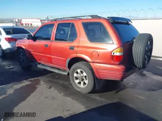 1999 Isuzu Rodeo S with VIN 4S2CK58W3X4307201, listed as a IAAI auction lot 41884901 with 236,970 mi miles. Bid and sale history available at carsss.com. Image 3.