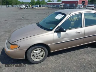 1999 Ford Escort LX z VIN 1FAFP10P7XW198467, wystawiony jako IAAI lot #42278961 z przebiegiem 293 835 mil mil oraz . Historia ofert i sprzedaży dostępna na DreamBid. Obrazek 6.