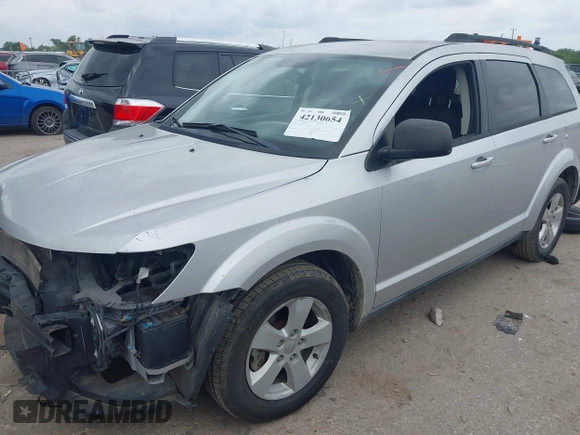 2013 Dodge Journey SE z VIN 3C4PDCAB9DT529668, wystawiony jako IAAI lot #42130654 z przebiegiem 156 472 mil mil oraz . Historia ofert i sprzedaży dostępna na DreamBid. Obrazek 18.