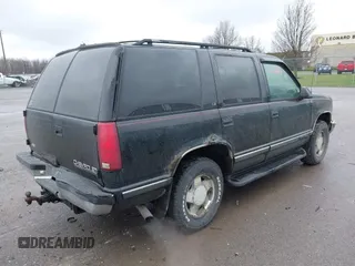 1999 Chevrolet Tahoe Z71 z VIN 1GNEK13R9XJ515820, wystawiony jako IAAI lot #42004125 z przebiegiem 251 184 mil mil oraz . Historia ofert i sprzedaży dostępna na DreamBid. Obrazek 4.