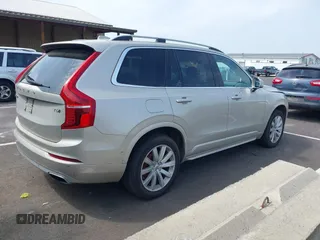 2016 Volvo XC90 T6 Momentum with VIN YV4A22PK7G1038750, listed as a IAAI auction lot 42128057 with 124,112 mi miles. Bid and sale history available at carsss.com. Image 4.