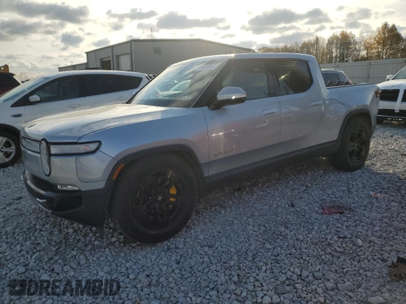 2023 Rivian R1T Adventure with VIN 7FCTGAAA2PN017170, listed as a Copart auction lot 77473014 with 28,821 mi miles and Salvage Title. Bid and sale history available at DreamBid. Image 1.