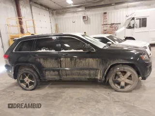 2015 Jeep Grand Cherokee Laredo with VIN 1C4RJFAG3FC607827, listed as a IAAI auction lot 41298397 with 198,171 mi miles. Bid and sale history available at carsss.com. Image 13.