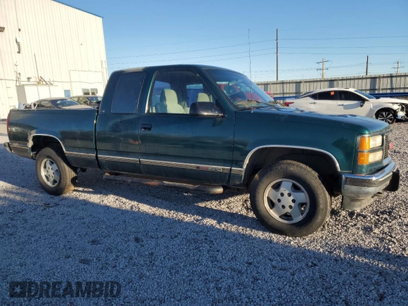1995 GMC Sierra 1500 z VIN 2GTEK19K6S1580355, wystawiony jako Copart lot #87416254 z przebiegiem 162 829 mil mil oraz Szkody całkowita. Historia ofert i sprzedaży dostępna na DreamBid. Obrazek 4.