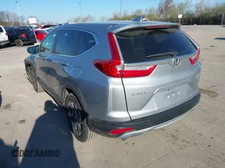 2018 Honda CR-V EX with VIN 7FARW2H56JE097214, listed as a IAAI auction lot 42061999 with 74,862 mi miles and . Bid and sale history available at DreamBid. Image 3.