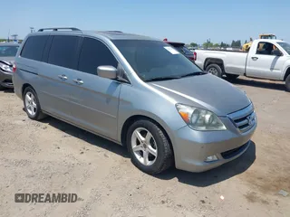 2006 Honda Odyssey Touring z VIN 5FNRL38876B017415, wystawiony jako IAAI lot #42417439 z przebiegiem 127 405 mil mil oraz . Historia ofert i sprzedaży dostępna na DreamBid. Obrazek 1.