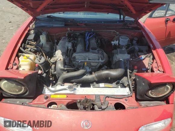 1993 Mazda MX-5 Miata z VIN JM1NA3511P0406871, wystawiony jako Copart lot #62239125 z przebiegiem 217 379 mil mil oraz Szkoda całkowita • Salvage title. Historia ofert i sprzedaży dostępna na DreamBid. Obrazek 11.