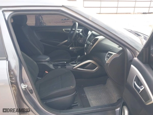 2016 Hyundai Veloster with VIN KMHTC6ADXGU277164, listed as a IAAI auction lot 41877724 with 136,690 mi miles. Bid and sale history available at carsss.com. Image 5.