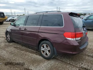 2010 Honda Odyssey Touring with VIN 5FNRL3H94AB056657, listed as a Copart auction lot 72658934 with 202,690 mi miles and Salvage title. Bid and sale history available at DreamBid. Image 2.