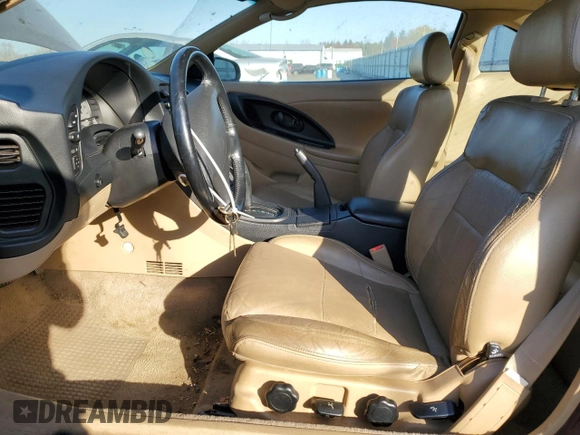 1999 Mitsubishi Eclipse with VIN 4A3AK44Y1XE074155, listed as a Copart auction lot 77143944 with 105,262 mi miles and Clean Title. Bid and sale history available at DreamBid. Image 7.
