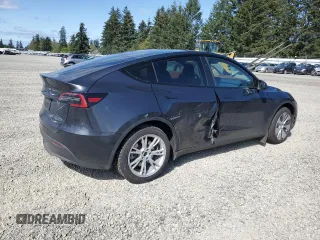 2024 Tesla Model Y Long Range with VIN 7SAYGAEE8RF987571, listed as a Copart auction lot 55110485 with 19,732 mi miles and Salvage title. Bid and sale history available at DreamBid. Image 3.