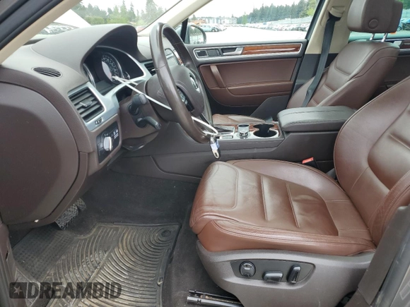 2012 Volkswagen Touareg Sport with VIN WVGFK9BP4CD001860, listed as a Copart auction lot 55090375 with 153,456 mi miles and Salvage title. Bid and sale history available at DreamBid. Image 7.