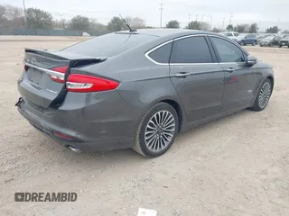 2017 Ford Fusion Titanium with VIN 3FA6P0SU8HR104727, listed as a IAAI auction lot 41242482 with 83,021 mi miles and . Bid and sale history available at DreamBid. Image 4.