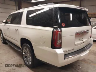 2015 GMC Yukon XL Denali with VIN 1GKS2JKJ1FR635901, listed as a IAAI auction lot 41805739 with 120,998 mi miles and . Bid and sale history available at carsss.com. Image 3.