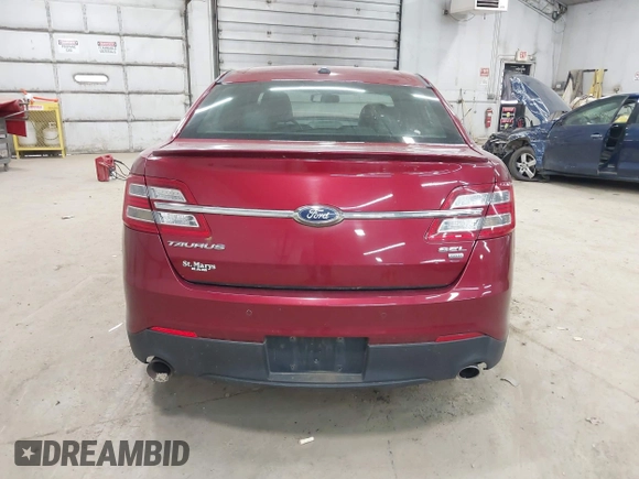 2015 Ford Taurus SEL z VIN 1FAHP2H88FG163179, wystawiony jako IAAI lot #42345579 z przebiegiem 142 424 mil mil oraz . Historia ofert i sprzedaży dostępna na DreamBid. Obrazek 16.