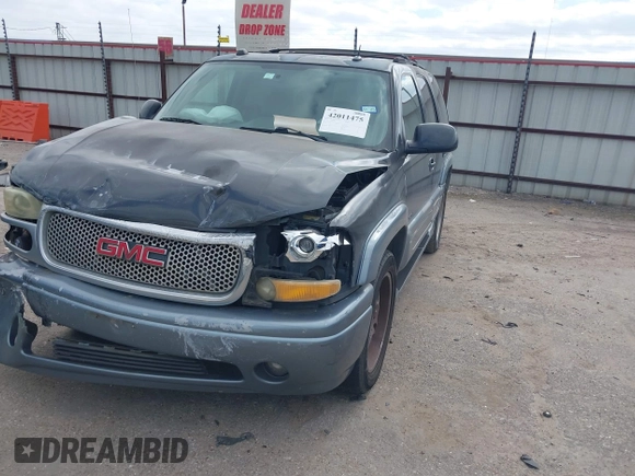 2004 GMC Yukon SLT z VIN 1GKEC13Z44J310511, wystawiony jako IAAI lot #42011475 z przebiegiem 218 746 mil mil oraz . Historia ofert i sprzedaży dostępna na DreamBid. Obrazek 2.