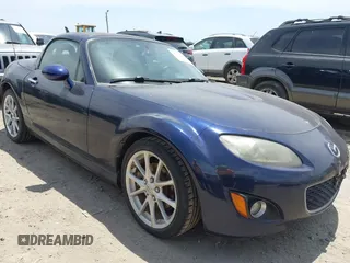 2012 Mazda MX-5 Miata Touring z VIN JM1NC2MF3C0221524, wystawiony jako IAAI lot #42237993 z przebiegiem 80 773 mil mil oraz . Historia ofert i sprzedaży dostępna na DreamBid. Obrazek 1.