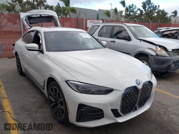 2023 BMW i4 eDrive40 z VIN WBY73AW05PFR28279, wystawiony jako IAAI lot #41262952 z przebiegiem 40 011 mil mil oraz . Historia ofert i sprzedaży dostępna na DreamBid. Obrazek 1.