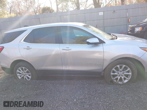 2021 Chevrolet Equinox LT with VIN 3GNAXUEV6MS165648, listed as a IAAI auction lot 41554980 with 71,647 mi miles and . Bid and sale history available at DreamBid. Image 12.