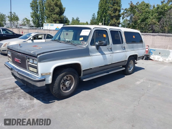 1990 GMC Suburban with VIN 1GKGR26NXLF528203, listed as a IAAI auction lot 42731684 with 185,736 mi miles and . Bid and sale history available at DreamBid. Image 2.