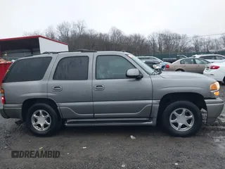 2005 GMC Yukon Denali z VIN 1GKEK63U25J228296, wystawiony jako IAAI lot #40980307 z przebiegiem 192 353 mil mil oraz . Historia ofert i sprzedaży dostępna na DreamBid. Obrazek 13.